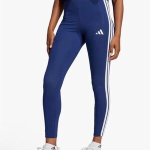 Never worn Adidas Women's Navy Leggings with White Stripes size L.